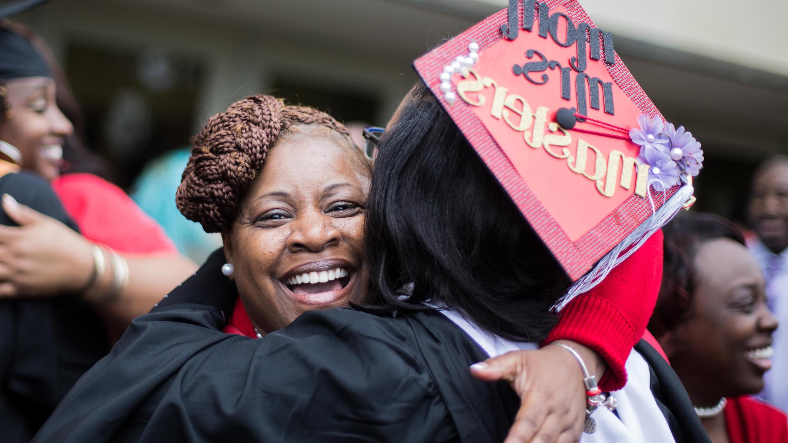 Family members hugging at commencement